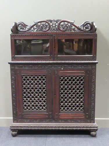 Lot 506 - A 19th century Anglo-Indian heavily carved...