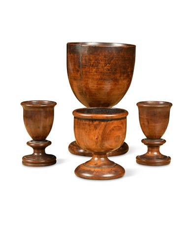 Lot 178 - A group of four fruitwood treen cups, 18th/19th century