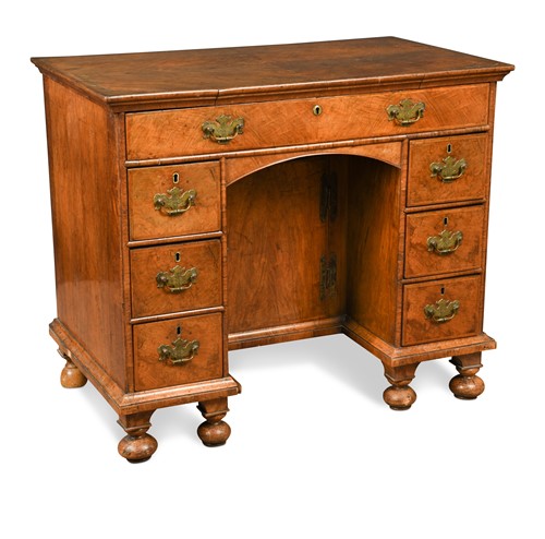 Lot 238 - A walnut kneehole desk, 18th century and later