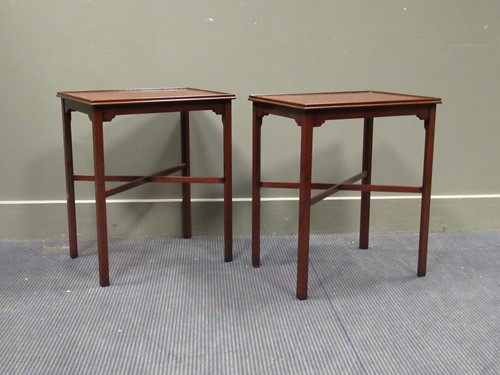 Lot 531 - A pair of Georgian style mahogany lamp tables...