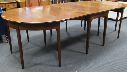 Lot 485 - A George III mahogany gateleg extending dining...