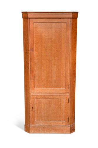 Lot 227 - A Heal's oak floor-standing corner cupboard