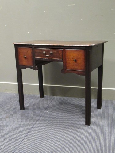 Lot 514 - An 18th century oak and fruitwood three drawer...