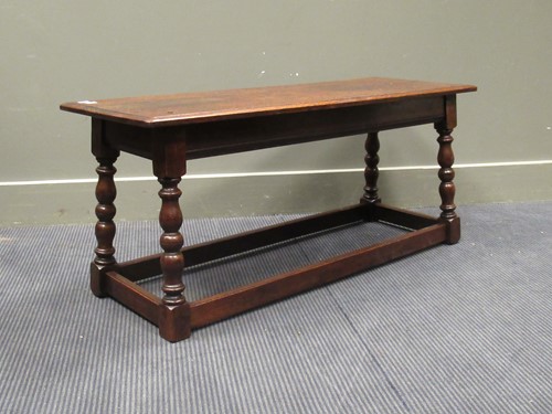 Lot 487 - An 18th century style oak bench on baluster...