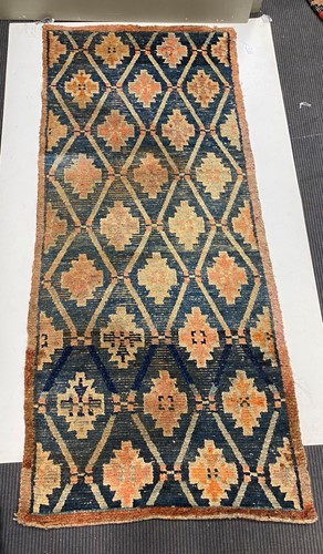 Lot 353 - A long Tibetan Khaden rug, 19th century