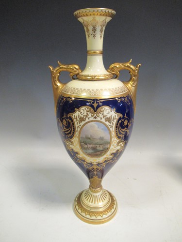 Lot 14 - A Coalport two-handled vase, each side painted...