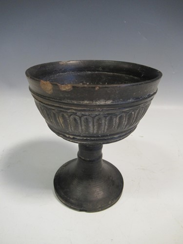 Lot 135 - A Greek antiquity black glazed pedestal bowl,...