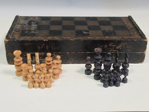 Lot 140 - A folding box chess board with pieces