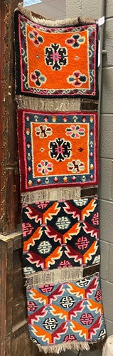 Lot 338 - Four Tibetan seat covers, early 1970s