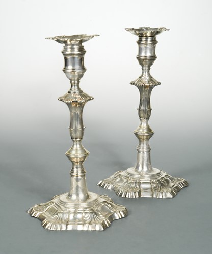 Lot 361 - A pair of George II cast silver candlesticks