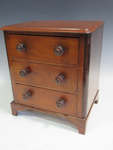 Lot 8 - A 19th century mahogany miniature chest of...