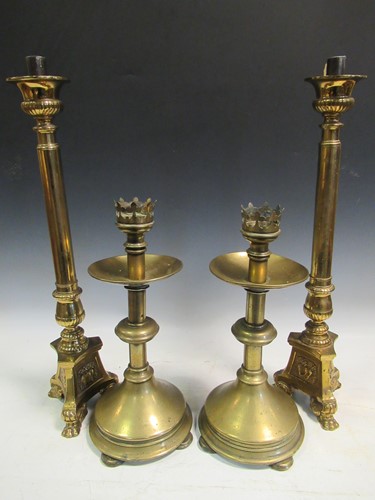 Lot 132 - Two pairs of brass candelsticks and a copper...