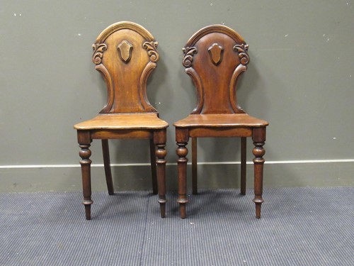 Lot 568 - A pair of Victorian hall chairs (2)