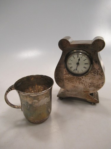Lot 236 - A silver lyre shaped mantle clock, 13cm high...