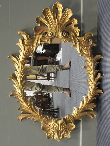 Lot 582 - A giltwood mirror, with acanthus cresting and...