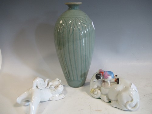 Lot 20 - A Chinese celadon glazed meiping vase carved...