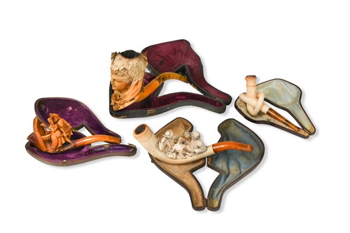 Lot 499 - Four cased carved Meersham pipes