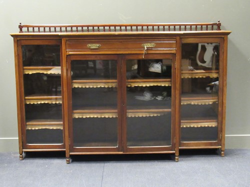 Lot 439 - A late Victorian walnut glazed breakfront...