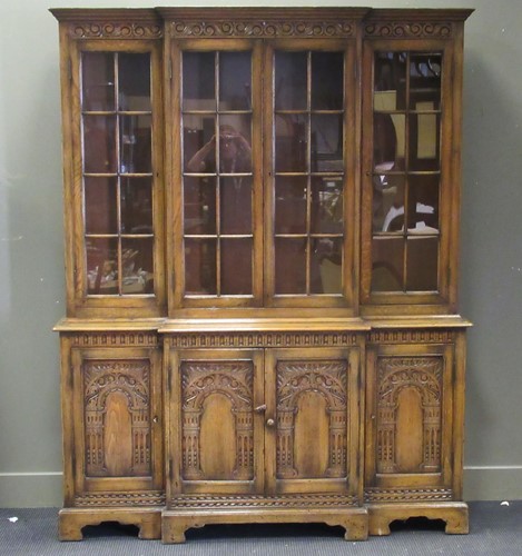 Lot 544 - An oak breakfront bookcase in the 18th century...