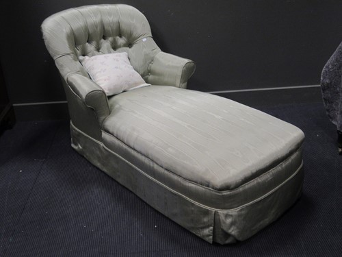 Lot 481 - A day bed upholstered in green moire silk type...