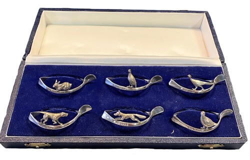 Lot 312 - A set of six late 20th century silver novelty napkin rings