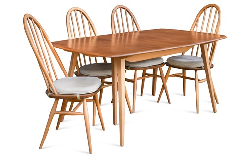 Lot 285 - An Ercol elm 'Windsor' extending dining table and eight chairs