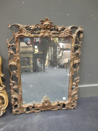 Lot 610 - A George III gilt framed mirror.