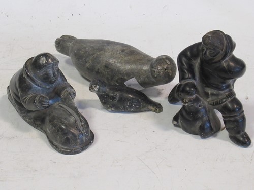 Lot 124 - A collection of four soapstone Inuit carvings,...