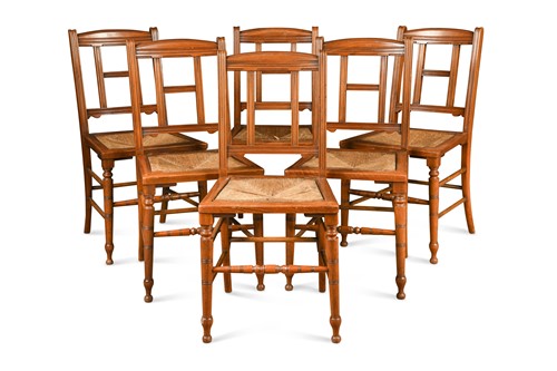 Lot 202 - In the manner of E.W. Godwin, a set of six walnut dining chairs