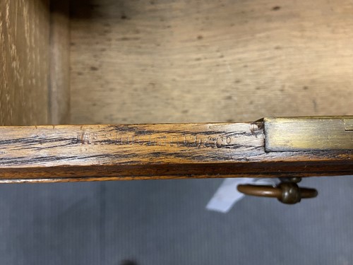 Lot 209 - An Arts & Crafts oak desk by James Shoolbred & Co.