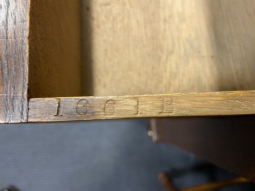 Lot 209 - An Arts & Crafts oak desk by James Shoolbred & Co.
