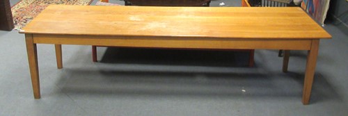Lot 431 - A large 20th century blonde oak tailors table,...