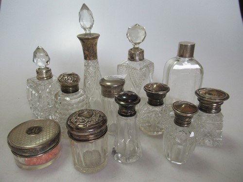 Lot 247 - A collection of glass scent bottles some...