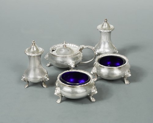 Lot 466 - A George V silver five-piece condiment set
