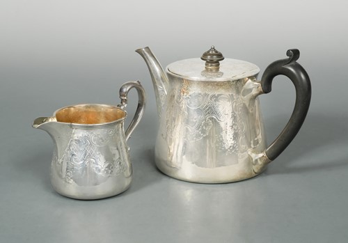 Lot 431 - A Victorian silver teapot and milk jug, mark of Robert Garrard II
