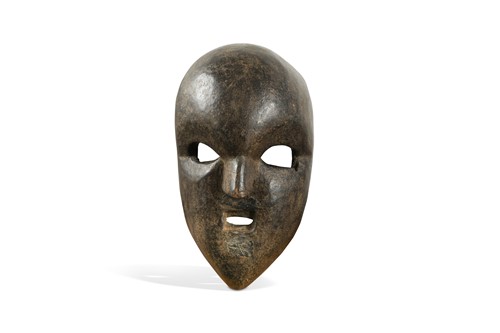Lot 242 - A Magar wood comic mask, North Western Nepal, probably 19th century or earlier