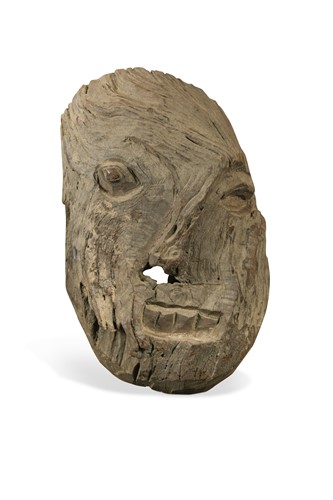 Lot 238 - A carved wood guardian deity head, Bardia Jungle, Terai Region, South Eastern Nepal, 19th/20th century