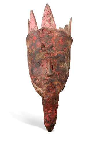 Lot 237 - A rare carved wood head of Kali, Terai District, Southern Nepal, probably 18th century