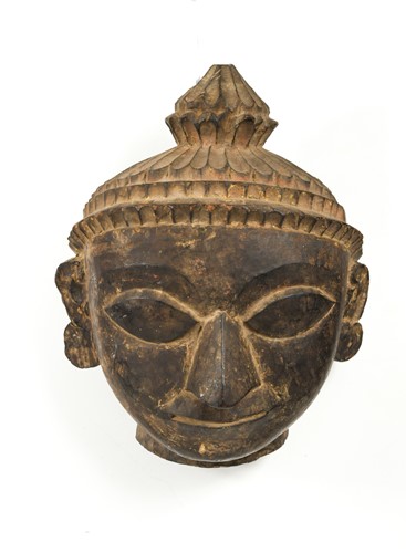 Lot 298 - A Tamang carved wood head of Buddha, Ganesh Himal Region or North Central Nepal, early 20th century