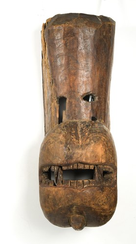 Lot 268 - A carved wood tiger head mask, Terai District of Southern Nepal, late 19th century