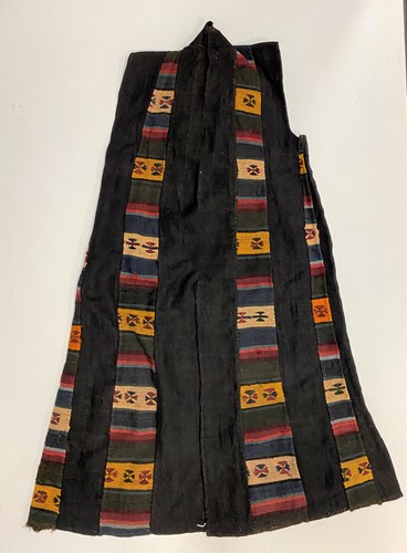 Lot 189 - A lady's long sleeveless overcoat, on black ground, Dolpo Region, Nepal, 19th century