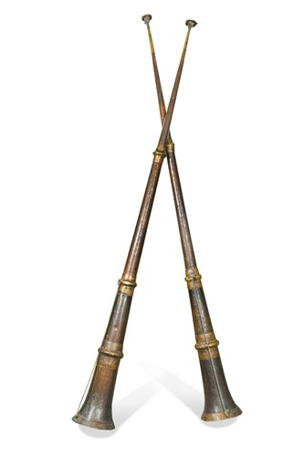 Lot 284 - A pair of Tamang beaten copper and brass mounted monastic ritual horns, Northern Nepal, late 19th /early 20th century