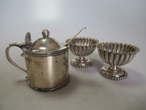 Lot 241 - A silver drum mustard with blue glass liner...