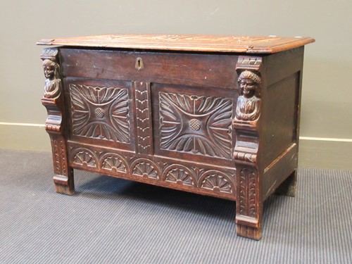 Lot 529 - A carved oak coffer or dower chest, basically...