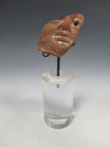 Lot 177 - A face fragment from a statue, possibly Roman,...
