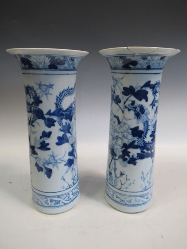 Lot 40 - A pair of Chinese blue and white cylindrical...