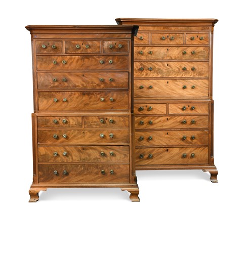 Lot 323 - A pair of George III mahogany chest on chests