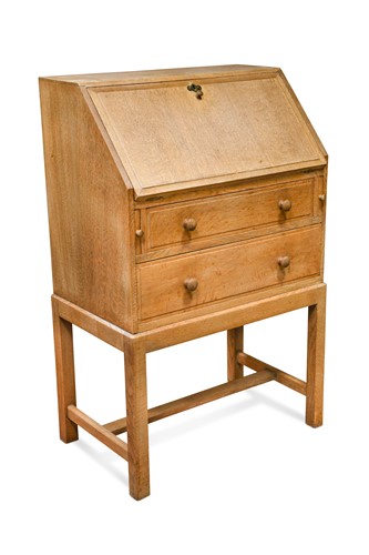 Lot 229 - A small Heal's oak bureau on stand, circa 1930s