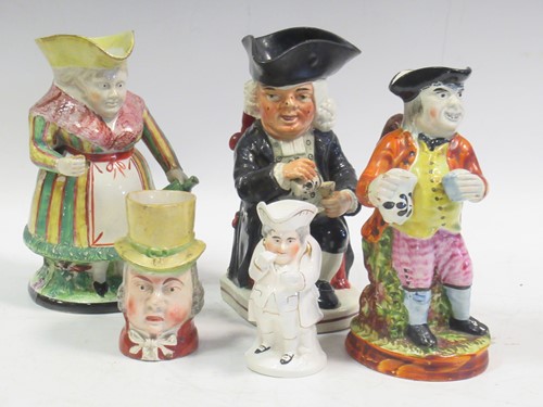 Lot 72 - A 19th century toby modelled as woman holding...