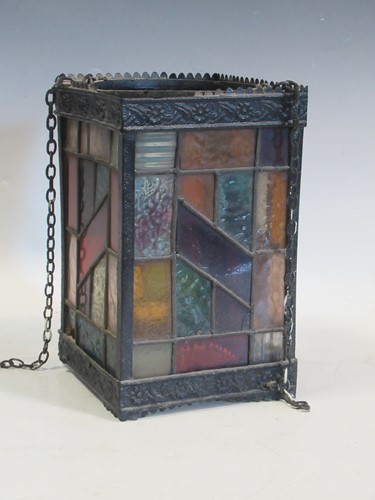 Lot 104 - A hanging lantern with stained glass panels 18...
